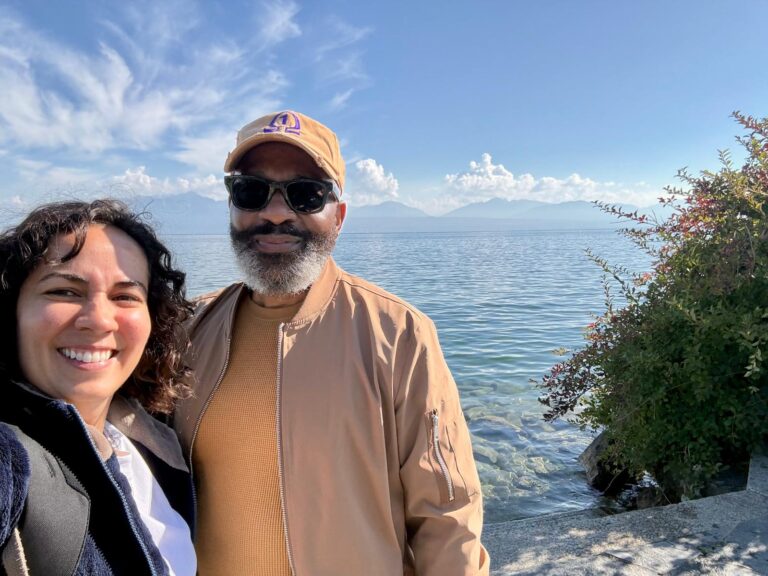 Two people taking a selfie beside Lake Geneva